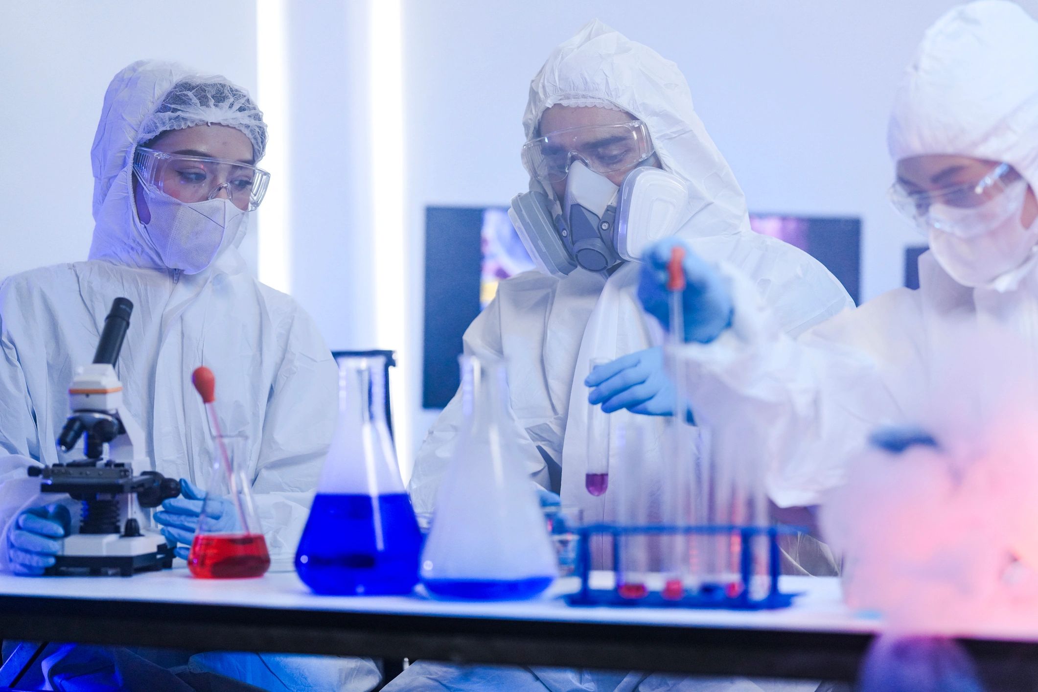 Chemists discussing research in a secure laboratory